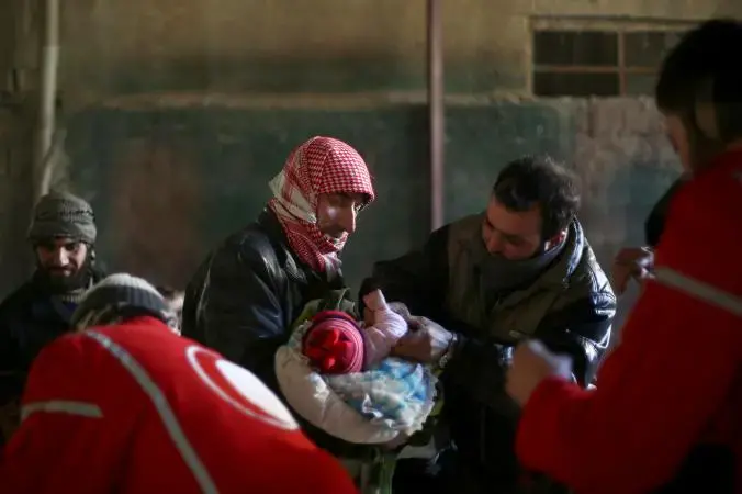 A Syrian infant receives a polio vaccination last month in a rebel-held area in a Damascus suburb. Though no new polio cases have been reported in more than a year, vaccinators must maintain their efforts because the health system has been destroyed in much of the country. Photograph by Abd Doumany, AFP/Getty. Syria, 2015. Media file: gettyimages_464130310_copy.adapt_.676.1.jpg