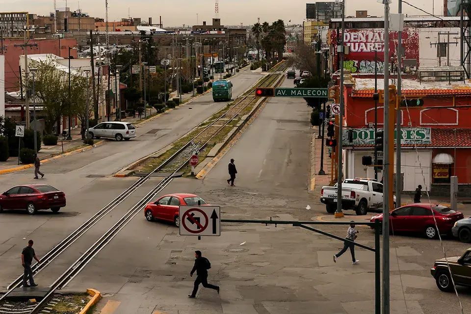 Juárez — the largest city in Chihuahua, Mexico — is home to around 1.3 million residents, according to 2010 data from Mexico’s National Institute of Statistics and Geography. Pedestrians cross the street in downtown Juárez. Image by Erika Schultz. Mexico, 2020. Juárez — the largest city in Chihuahua, Mexico — is home to around 1.3 million residents, according to 2010 data from Mexico’s National Institute of Statistics and Geography. Pedestrians cross the street in downtown Juárez. Image by Erika Schultz. Mexico, 2020.