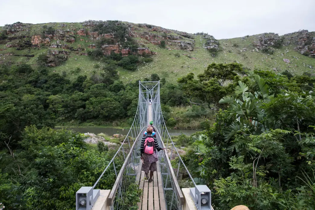 A footbridge over the River Mzamba links Pondoland with the town of Port Edward. Image by Krisanne Johnson for Yale E360. South Africa, 2017. A footbridge over the River Mzamba links Pondoland with the town of Port Edward. Image by Krisanne Johnson for Yale E360. South Africa, 2017.
