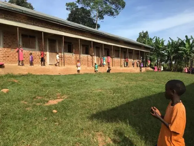 Students play in the school yard of a Building Tomorrow School as they wait to receive their report cards. Image by Brandon Posner. Uganda, 2016. Students play in the school yard of a Building Tomorrow School as they wait to receive their report cards. Image by Brandon Posner. Uganda, 2016.