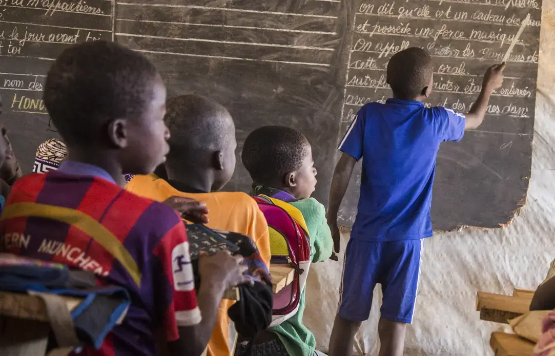 Children learn in a makeshift classroom located in a sprawling camp for thousands of displaced families in the Central African Republic. Image by Jack Losh. Central African Republic, 2018. Children learn in a makeshift classroom located in a sprawling camp for thousands of displaced families in the Central African Republic. Image by Jack Losh. Central African Republic, 2018.