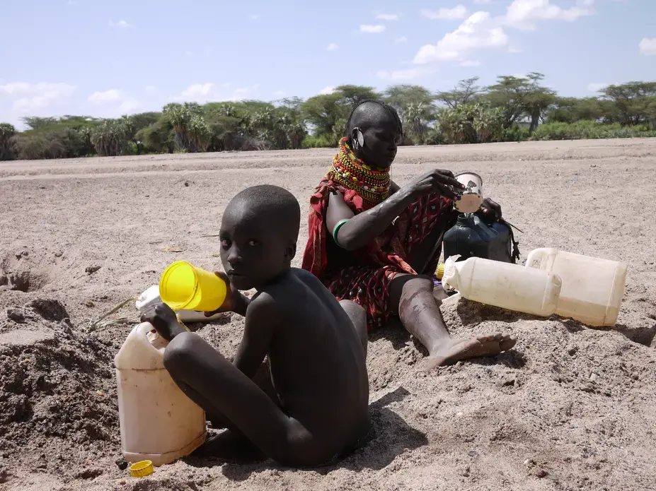 In Turkana, Kenya, a community of 600 people get their water from a hole in the ground after their water pump broke. Children have become sick drinking the dirty water, village elders say. Image by Samuel Loewenberg. Kenya, 2014. Media file: p1090773.jpg