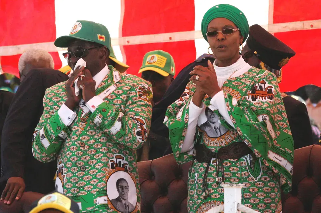 Grace Mugabe with Robert Mugabe. Image courtesy of Wikicommons user DandjkRoberts. Zimbabwe, 2013. Media file: grace_mugabe_with_robert_mugabe_2013-08-04_11-53.jpg