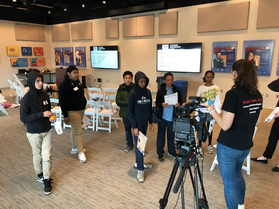 Becky Wandel, production assistant with PBS NewsHour Student Reporting Labs, shows the students how to arrange an on-camera interview. Image by Libby Moeller. United States, 2020.