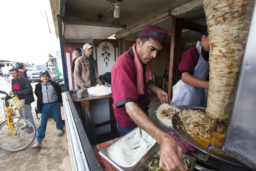 This shawarma shop feeds refugee families at affordable prices. Image by Mark Hoffman. Jordan, 2016. Media file: jordan_shawarma_hoffman.jpg