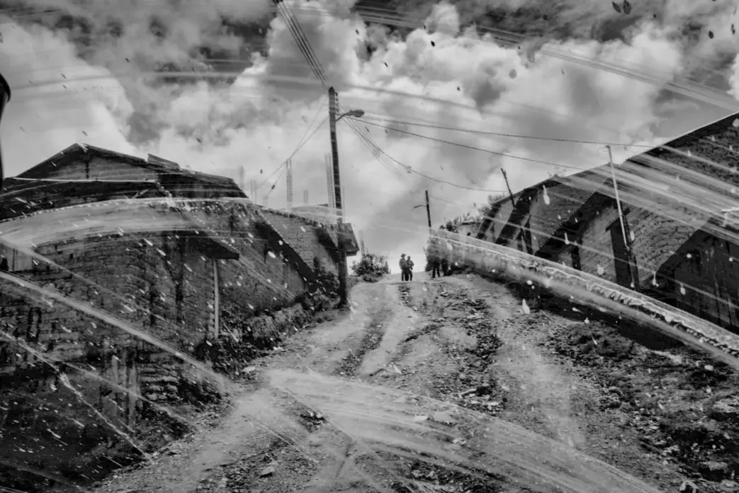 A street in Moyotepec, Guerrero. Over a quarter of Guerrero’s population has migrated to the United States. Image by Matt Black. Mexico, 2014. Media file: monster_final08-1200.jpg
