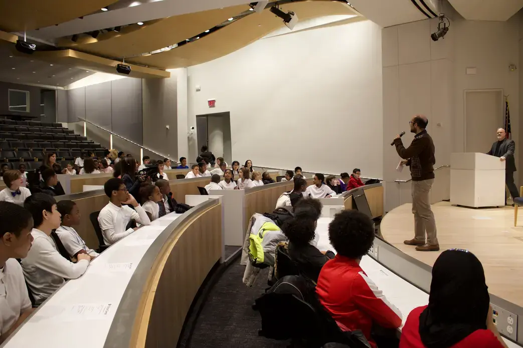 Students prepare to listen to a panel at USA Today that will discuss the importance of journalism and how newspapers and media outlets produce the news today. Image by Alyssa Sperrazza. United States, 2018.