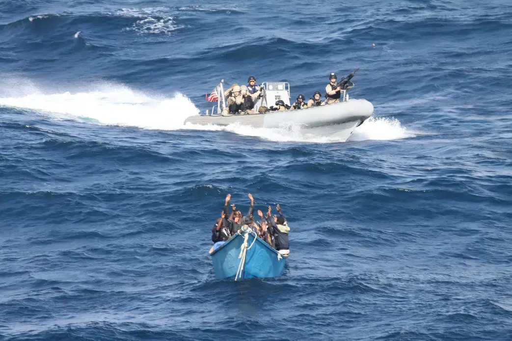 A visit, board, search and seizure team from the guided-missile destroyer USS Pinckney (DDG 91) approaches a suspected pirate vessel after the Motor Vessel Nordic Apollo reported being under attack and fired upon by Somali pirates. Image courtesy of U.S. Navy photo. Gulf of Aden, Dec. 19, 2011. Media file: us_navy_111219-n-zz999-070_a_visit_board_search_and_seizure_team_from_the_guided-missile_destroyer_uss_pinckney_ddg_91_approaches_a_suspected_p.jpg