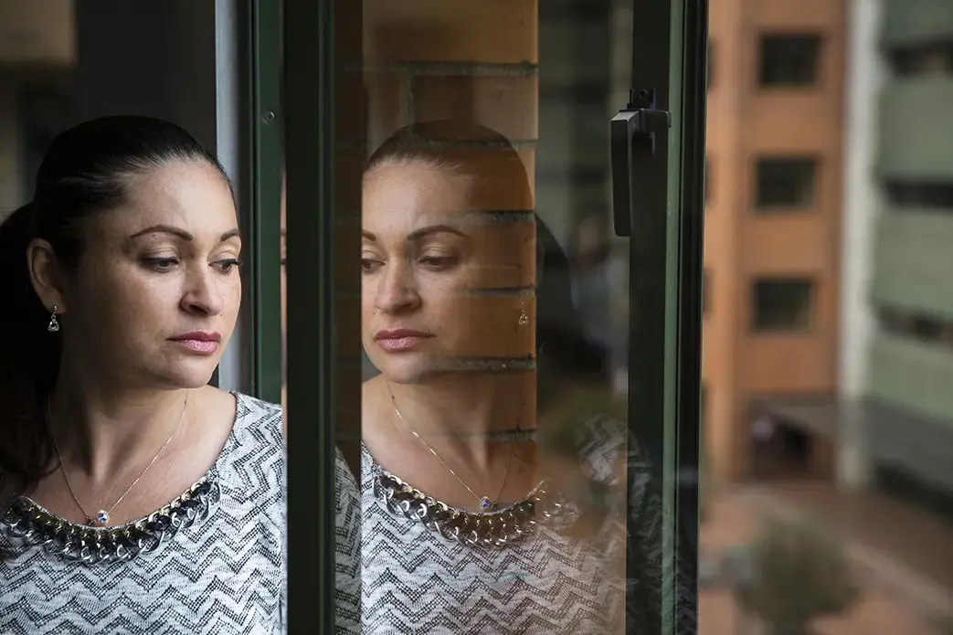 Members of Elenith's family have a mutation that causes early-onset Alzheimer's disease, but she doesn't know whether she will develop the disease. "It has haunted me all of my life but I want to be prepared if possible," she says. Image Greg Kendall-Ball. Colombia, 2018. Members of Elenith's family have a mutation that causes early-onset Alzheimer's disease, but she doesn't know whether she will develop the disease. "It has haunted me all of my life but I want to be prepared if possible," she says. Image Greg Kendall-Ball. Colombia, 2018.