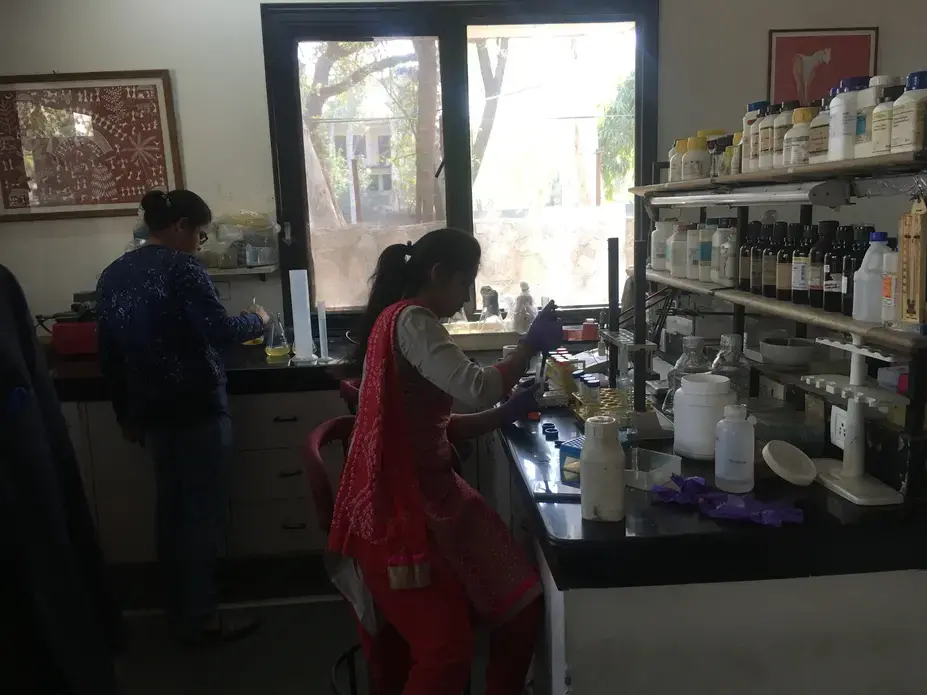 Two lab assistants prepare for clinical trials of a contraceptive vaccine at the Talwar Foundation in Delhi. Image by Hannah Harris Green. India, 2018. Two lab assistants prepare for clinical trials of a contraceptive vaccine at the Talwar Foundation in Delhi. Image by Hannah Harris Green. India, 2018.