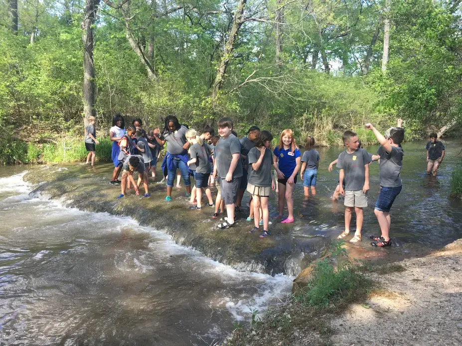 Elementary school students play in the water at the Chickasaw National Recreation Area near Sulphur, Oklahoma. After the state of Oklahoma experienced an extended drought in 2011-2012, officials put together a drought mitigation plan for this region. Image by Lenzy Krehbiel-Burton / Harvest Public Media. United States, 2020.