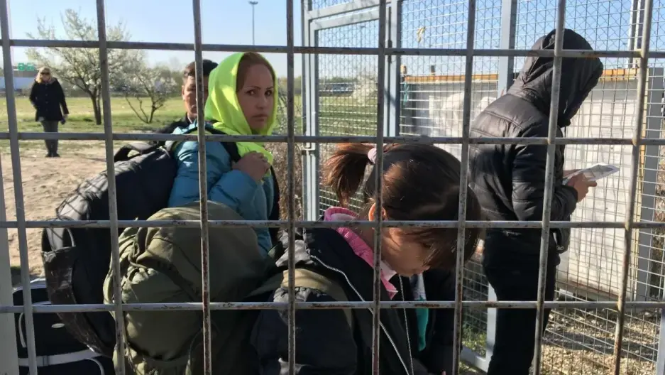 An Afghan refugee family enters Hungary from Serbia. Under a controversial new Hungarian border law, they live in a detention camp at the border until their case is decided. Image by Jeanne Carstensen. Hungary, 2017. An Afghan refugee family enters Hungary from Serbia. Under a controversial new Hungarian border law, they live in a detention camp at the border until their case is decided. Image by Jeanne Carstensen. Hungary, 2017.