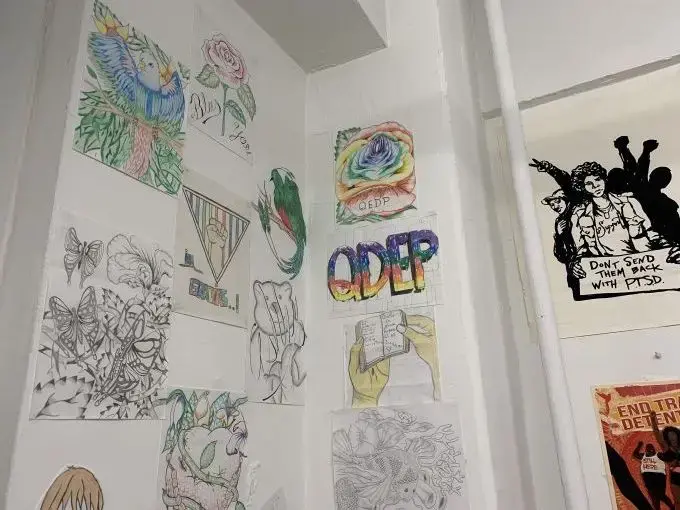 Drawings featured on one of the walls of the Queer Detainee Empowerment Project’s office. Several were created by detainees and sent to the organization from detention centers. Image by Adithi Ramakrishnan. United States, 2020. Drawings featured on one of the walls of the Queer Detainee Empowerment Project’s office. Several were created by detainees and sent to the organization from detention centers. Image by Adithi Ramakrishnan. United States, 2020.