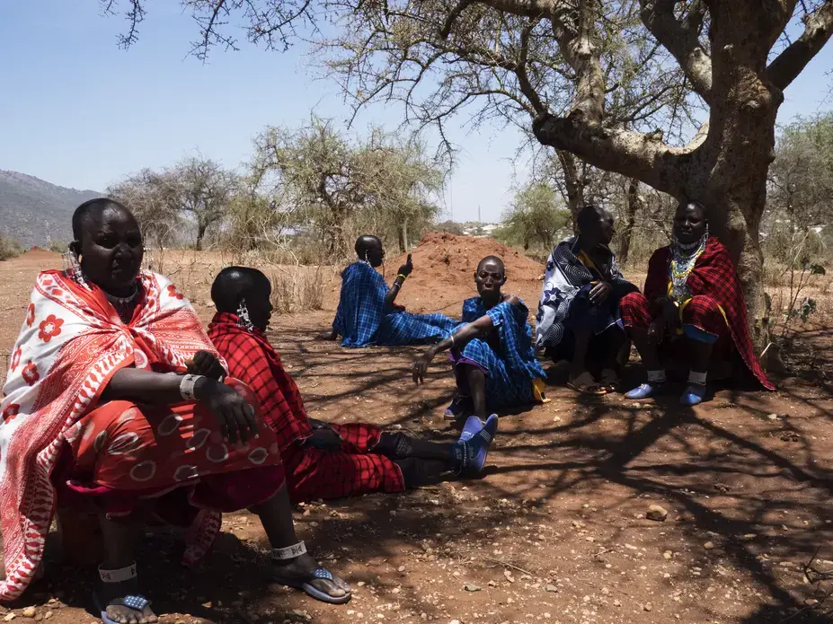 Orendeke village. Maasai women activists meeting and discussing further proceedings. They were tricked by an official out of a deed they had on land, loosing 2/3 of the surface. A NGO built milk center is now in the middle of a developping area and can not be used. They are planning on taking the case to court. Image by Thomas Dworzak. Tanzania, 2018. Orendeke village. Maasai women activists meeting and discussing further proceedings. They were tricked by an official out of a deed they had on land, loosing 2/3 of the surface. A NGO built milk center is now in the middle of a developping area and can not be used. They are planning on taking the case to court. Image by Thomas Dworzak. Tanzania, 2018.