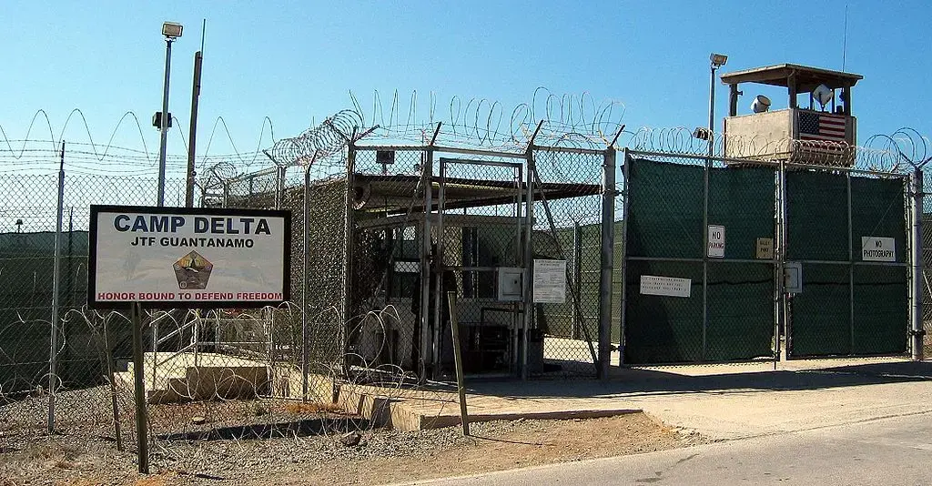 The entrance to Camp 1 in Guantanamo Bay's Camp Delta. The base's detention camps are numbered based on the order in which they were built, not their order of precedence or level of security. Image by Kathleen T. Rhem/Wikimedia Commons. Cuba, 2005. The entrance to Camp 1 in Guantanamo Bay's Camp Delta. The base's detention camps are numbered based on the order in which they were built, not their order of precedence or level of security. Image by Kathleen T. Rhem/Wikimedia Commons. Cuba, 2005.