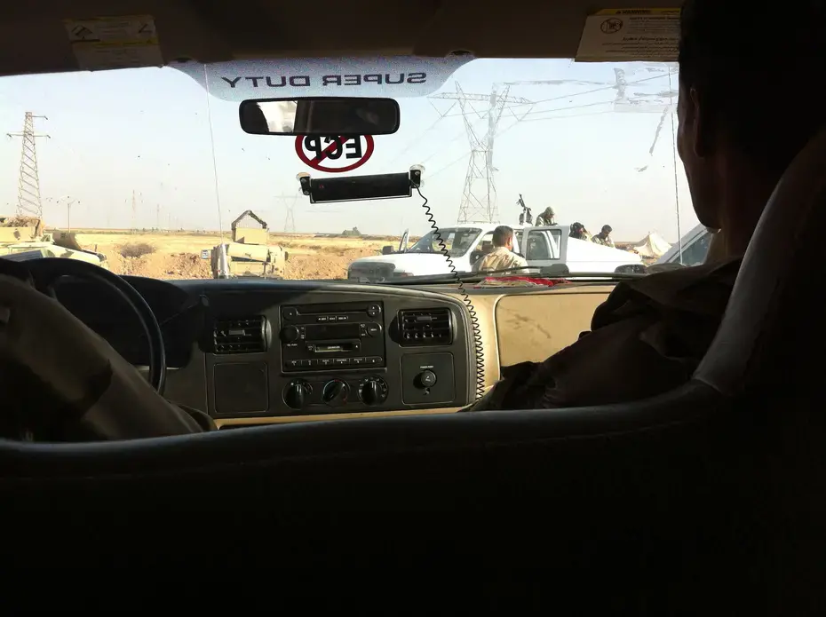 Peshmerga fighters on their way to the front line near Kirkuk in late June, 2014. Image by Jenna Krajeski. Kurdistan, 2014. Media file: img_1984.jpg