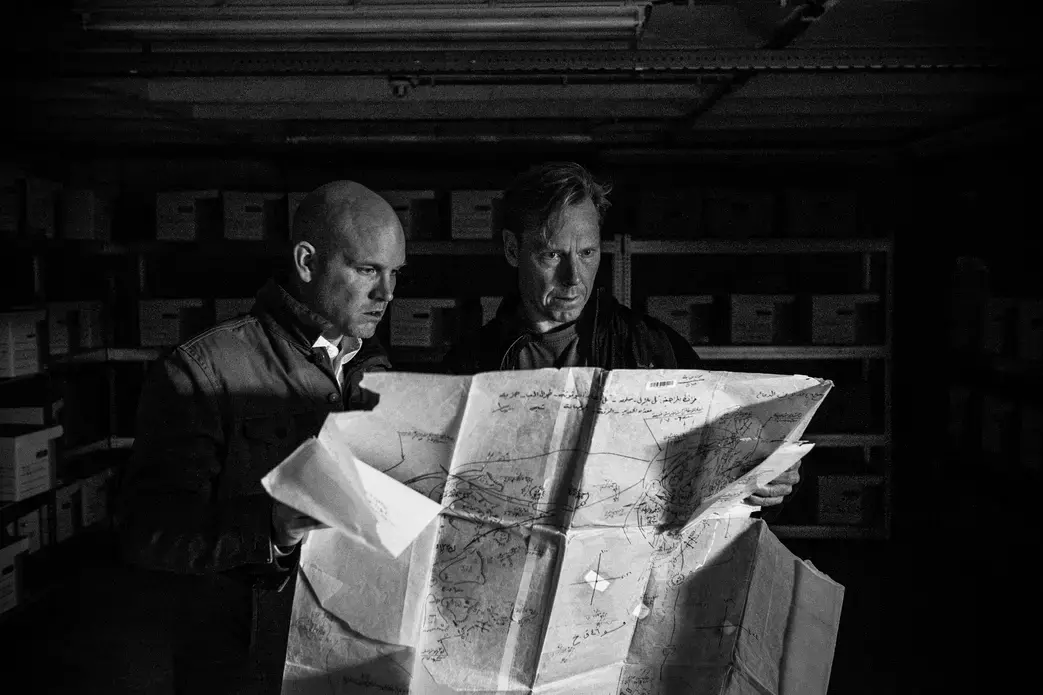 Chris Engels and Bill Wiley examine a tracer map inside the evidence room of the Commission for International Justice and Accountability. Image by Ben Taub. Europe, 2016. Media file: 160106_head_of_regime_crimes_and_director_1.jpg