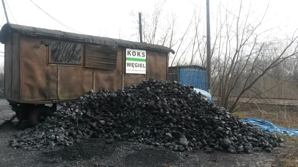 Krakow residents buy coal for home furnaces at this lot on the edge of town. Many burn it in low tech, filterless old stoves, helping to make Krakow's air the third-worst in Europe. Image by Beth Gardiner. Poland, 2015. Media file: trailer-coal.jpg