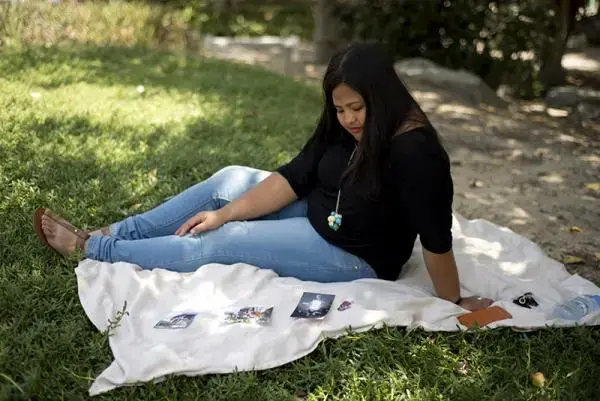 Sometimes Loraine feels like her daughter only sees her as someone who can send her money and buy her things. "But that’s my fault isn’t it? That’s the price I have to pay for leaving hers," says Loraine. Image by Jo Kearney. U.A.E., 2014. Media file: migrant_nanny_mom.jpg