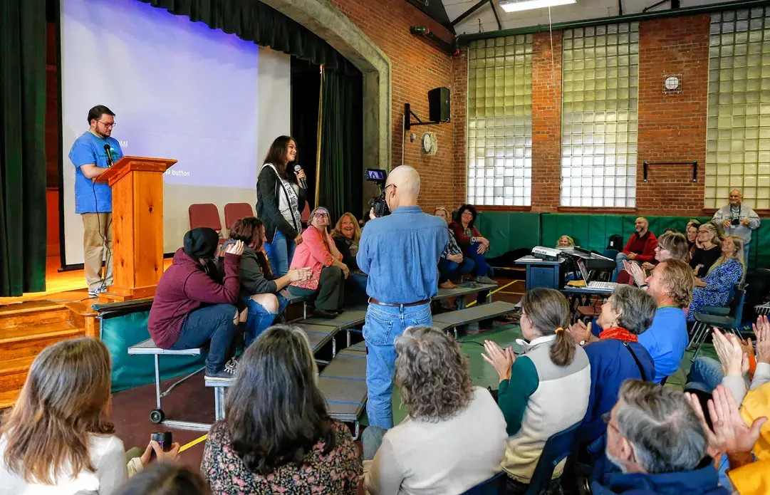 Letcher County, Ky. delegation gives a presentation to Leverett, Mass. audience. Image by Greenfield Recorder. United States, 2017. Letcher County, Ky. delegation gives a presentation to Leverett, Mass. audience. Image by Greenfield Recorder. United States, 2017.
