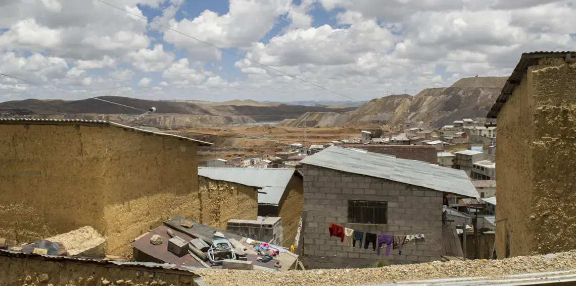 The Raúl Rojas open-pit mine seen from Paraghsa, one of the worst affected neighbourhoods in Cerro de Pasco. The pit stretches for 1.2 miles and is over 1,000 feet deep. Image by Ricardo Martinez. The Raúl Rojas open-pit mine seen from Paraghsa, one of the worst affected neighbourhoods in Cerro de Pasco. The pit stretches for 1.2 miles and is over 1,000 feet deep. Image by Ricardo Martinez.