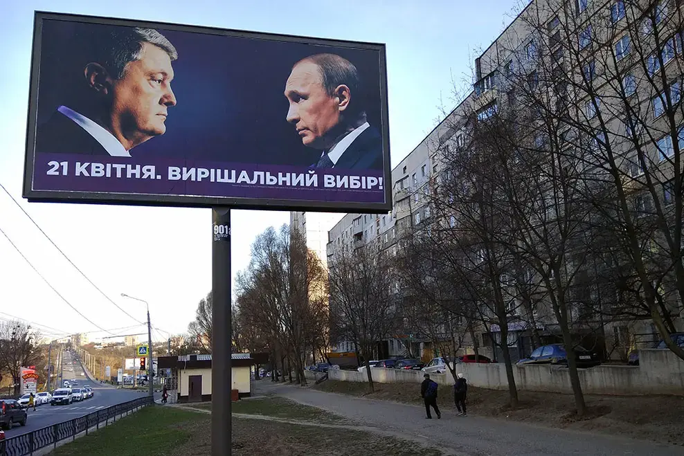 Billboard with portraits of Ukrainian President Petro Poroshenko and Russian president Vladimir Putin, ahead of the second round of 2019 Ukraine Presidential Election. Image by Aquatarkus / Shutterstock.com. Ukraine, 2019. Billboard with portraits of Ukrainian President Petro Poroshenko and Russian president Vladimir Putin, ahead of the second round of 2019 Ukraine Presidential Election. Image by Aquatarkus / Shutterstock.com. Ukraine, 2019.