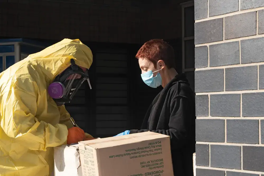 A men in a full protective suit delivers supplies to Elmhurst Hospital due to COVID-19 outbreak on March 26, 2020 in Queens neighborhood of New York City. Image by Ron Adar / Shutterstock. United States, 2020. A men in a full protective suit delivers supplies to Elmhurst Hospital due to COVID-19 outbreak on March 26, 2020 in Queens neighborhood of New York City. Image by Ron Adar / Shutterstock. United States, 2020.