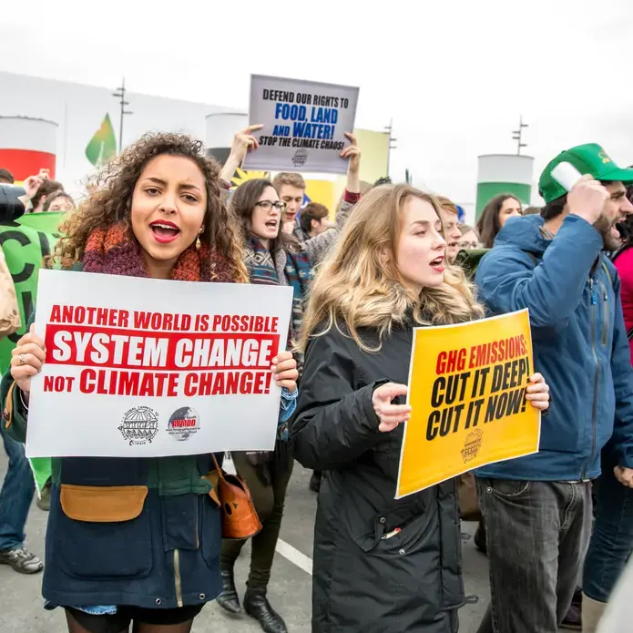 In December 2015, youth at the climate negotiations in Paris called COP21 protest for climate action. Image courtesy of Christian O'Rourke/ SustainUS. France, 2015. Media file: system_change_photo-_cop21.jpg