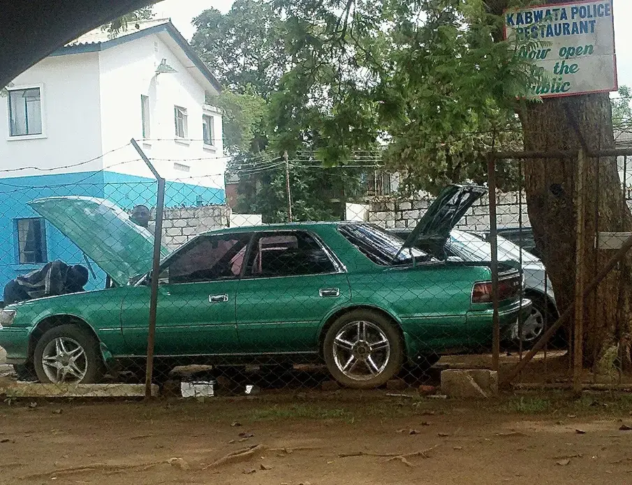 Everyone's an entrepreneur in Lusaka, the capital of Zambia. Informal commerce bustles on the city's streets. Image by Jina Moore. Zambia, 2014. Media file: fixing_the_teal_machine.jpg