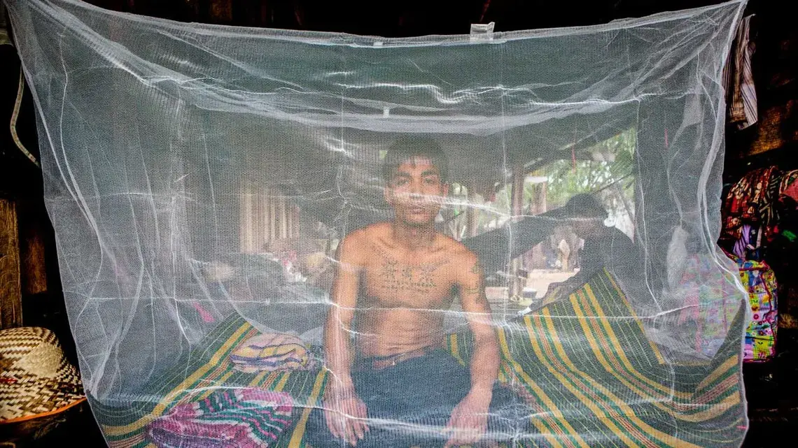 Migrant workers such as this man in Pailin, Cambodia, near the border with Thailand, are at especially high risk of contracting malaria. Image by Jeffrey Lau. Cambodia, 2016. Media file: malaria.jpg