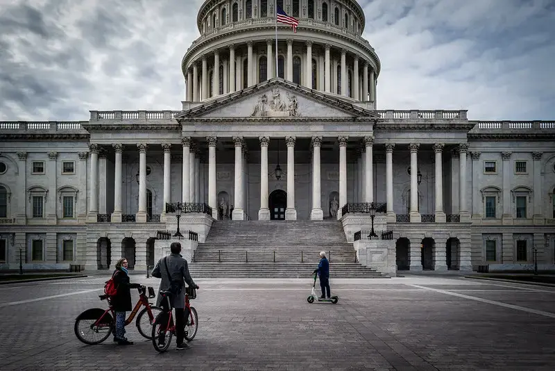 On a day when nearly every museum and landmark was closed due to COVID-19, tourists use rental bikes and scooters to view the outside of the U.S. Capitol. Image by Phil Roeder / Flickr. United States, 2020. On a day when nearly every museum and landmark was closed due to COVID-19, tourists use rental bikes and scooters to view the outside of the U.S. Capitol. Image by Phil Roeder / Flickr. United States, 2020.