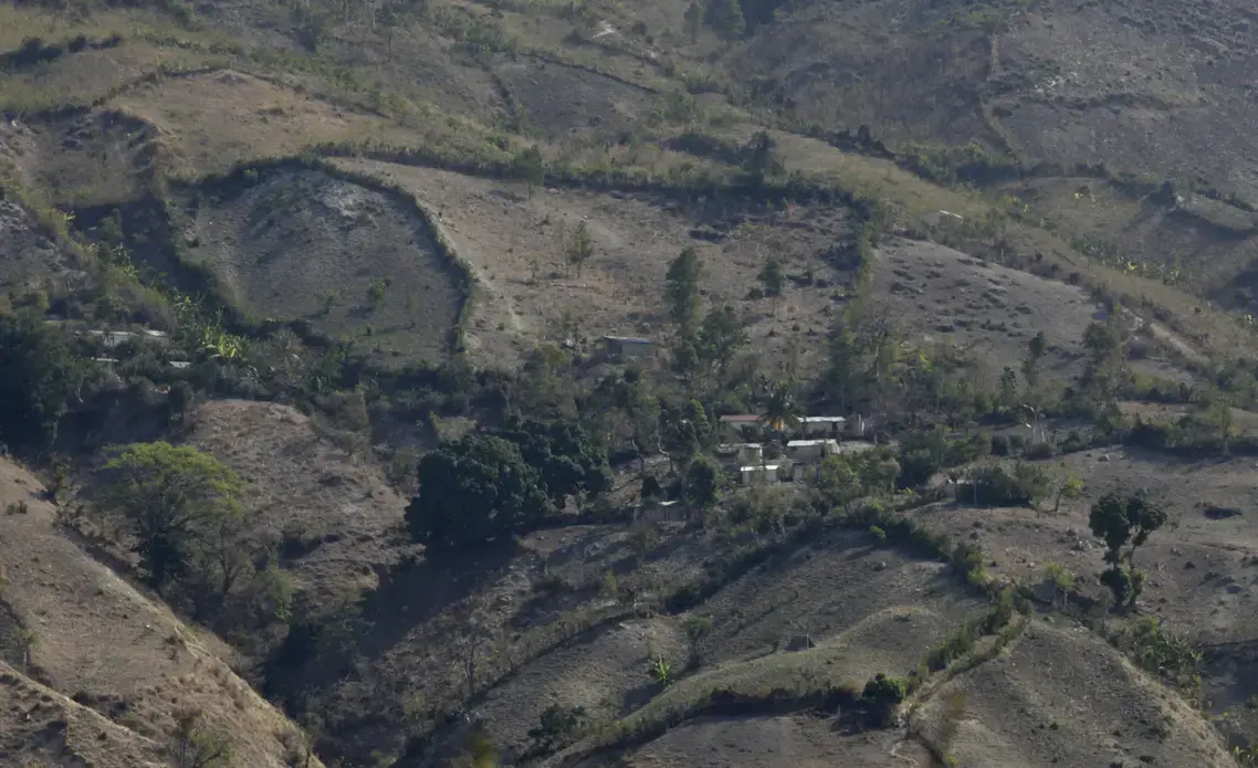 Haitian farmers scratch out a living in mountain areas that have lost much of their tree cover. Image by Mary Chind. Haiti, 2013. Media file: dmrdc5-69kvqxn222oz65ubog1_original.jpg