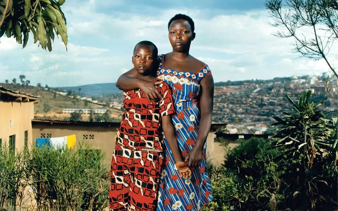 Josette, 40, and her son Thomas, 24: Josette was beaten and raped by militiamen. After the genocide, a pregnant Josette was rejected by members of her family. Thomas is now training to be a plumber  Image by Jonathan Torgovnik. Rwanda, 2019.