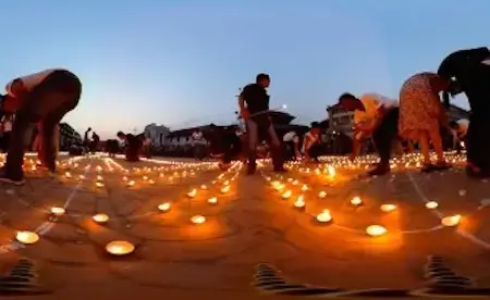 360° Video Shows Nepal One Year After Earthquake People lighting candles in Nepal one year after earthquake