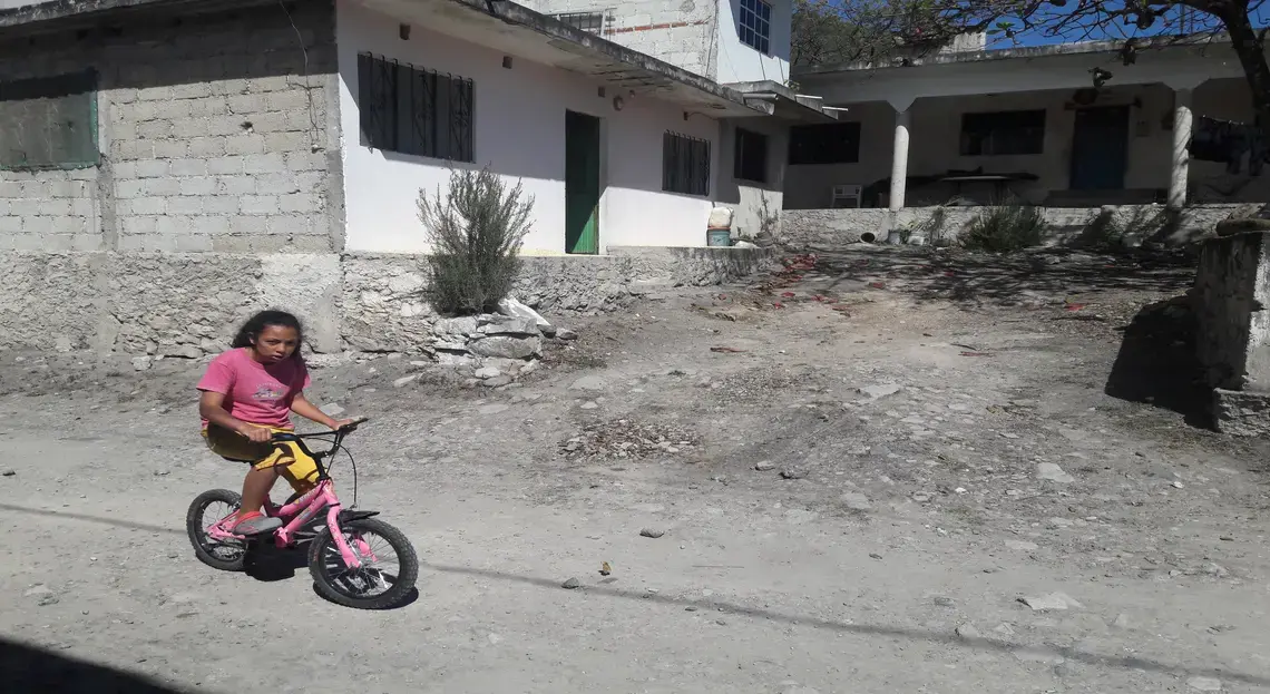 A young girl rides her bike through Coyolillo, a small town in Veracruz with a high population of Afro-Mexicans. Image by Jonathan Custodio. Mexico, 2018. A young girl rides her bike through Coyolillo, a small town in Veracruz with a high population of Afro-Mexicans. Image by Jonathan Custodio. Mexico, 2018.