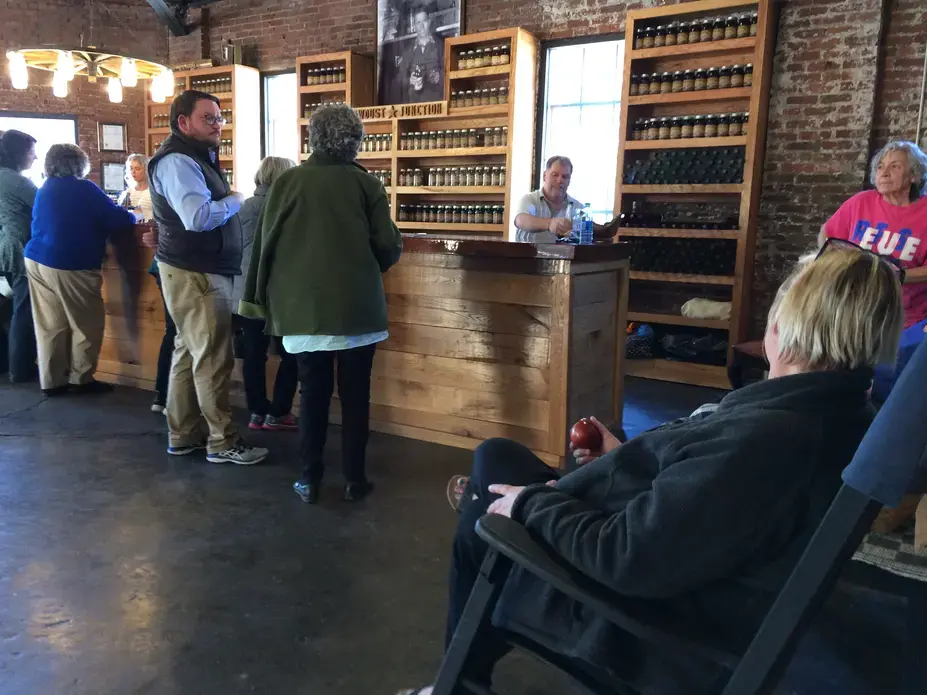 Leverett and Letcher County residents gather at Kentucky Mist Moonshine in Whitesburg, Ky. Image by Richie Davis. United States, 2018.
