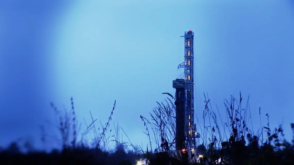 A shale gas drilling rig near the village of Strzeszewo, Poland, has some local residents worried about the impact
of hydraulic fracturing on their lives. Image by Stephen Sapienza. Poland, 2013. Media file: shale_gas_poland_still.png