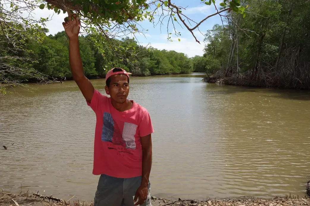 Schoolteacher Jorge Gonez is concerned that a proposed canal would ruin his favorite fishing hole on the Brito River, which lies in the project's path. Image by Chris Kraul. Nicaragua, 2015. Media file: nicacanallagoon.jpg