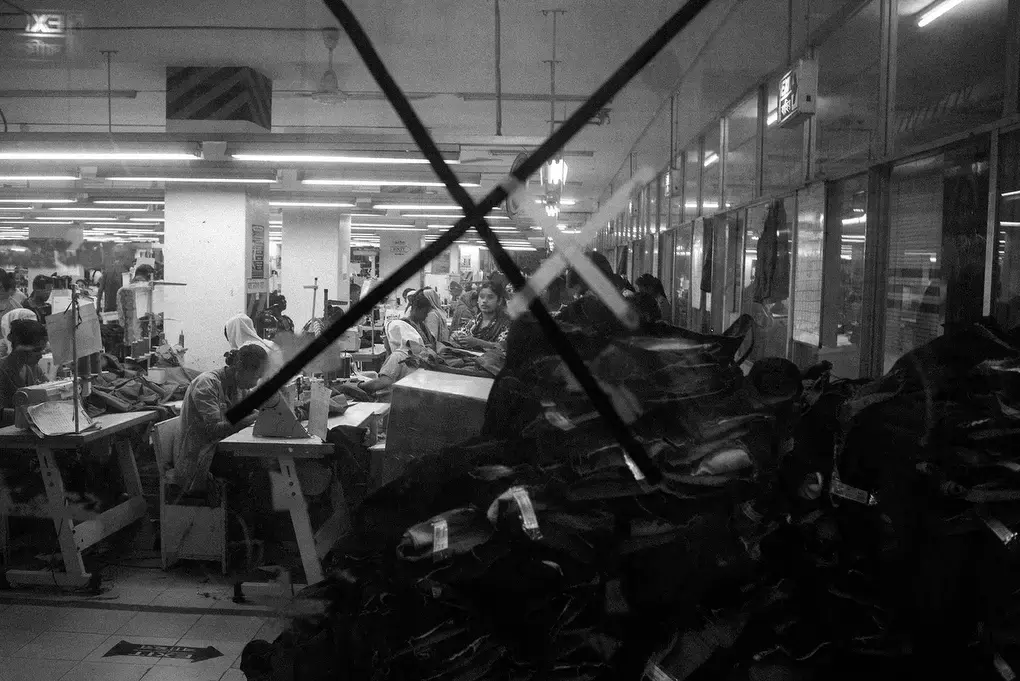 Workers are seen in a garment factory in Mirpur area in Dhaka. The factory employs 1200 workers, who mostly produce jeans and jackets. Image by Jost Franko. Bangladesh, 2016.