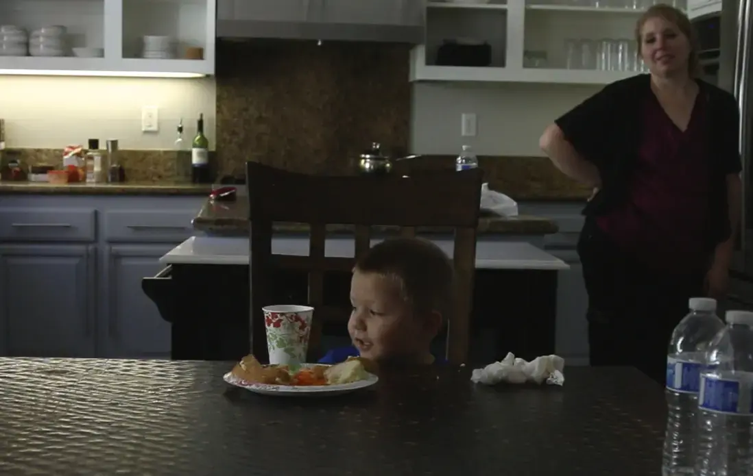 Three-year-old Lucian Olivera enjoys a meal at home. He was inflicted with a rare polio-like illness when he was 11 months old, leaving both of his legs paralyzed. Image by Jake Nicol. California. Media file: screen_shot_2015-05-05_at_10.26.28_am_3.jpg