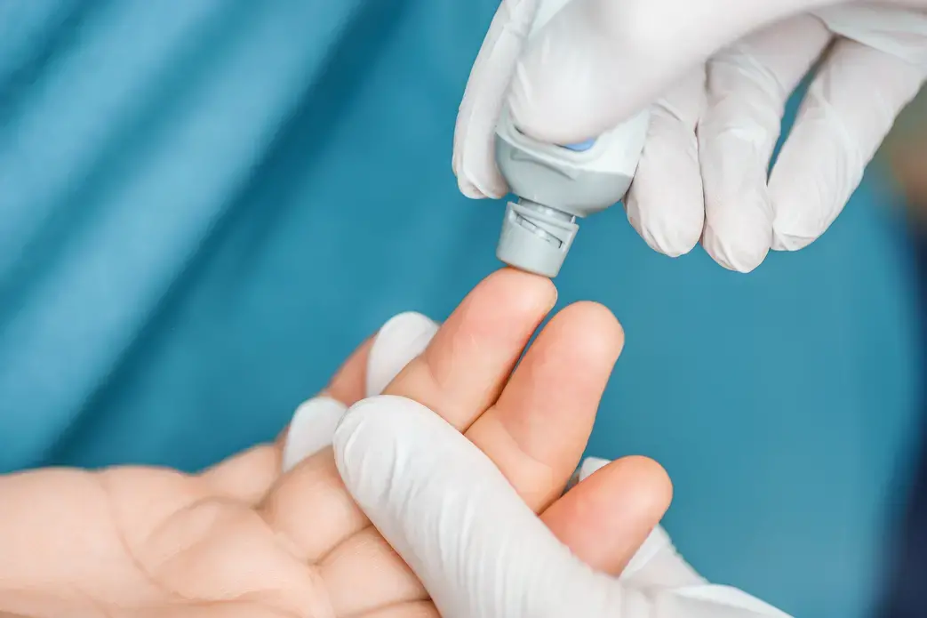 A doctor tests a patient's blood at the hospital. Image via Shutterstock. A doctor tests a patient's blood at the hospital. Image via Shutterstock.