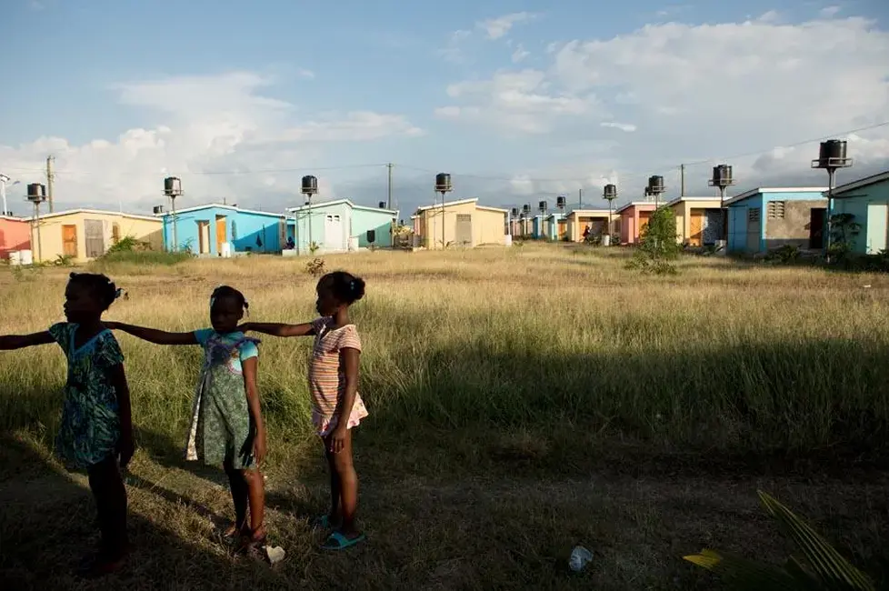Third graders practice a marching drill after school with the help of their teacher Diendonne Daniel in preparation for a Flag Day ceremony to be held on May 18 in the village of La Difference. Image by Allison Shelley. Haiti, 2015. Media file: screen_shot_2015-05-05_at_11.50.16.png