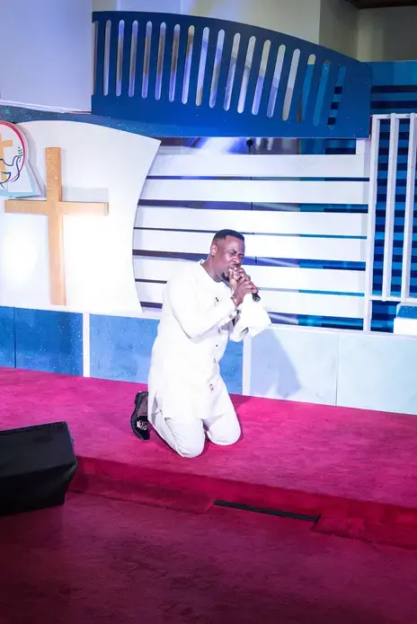 Prophet Nigel Gaise during an evening service. Gaise, a former engineer student, is openly homophobic and his faithful community is growing year after year. Image by Tomaso Clavarino. Ghana, 2018.