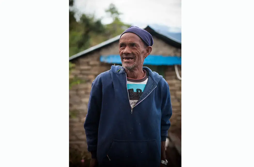 Many Nepalis, such as this man from the village of Kaskikot, expect their teeth to fall out with old age. Image by John Healey. Nepal, 2013. Media file: jmiller.jpg
