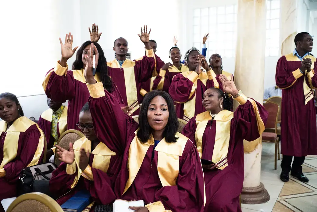 Youngsters during Sunday service at the Streams of Power church in Accra. Image by Tomaso Clavarino. Ghana, 2017.
