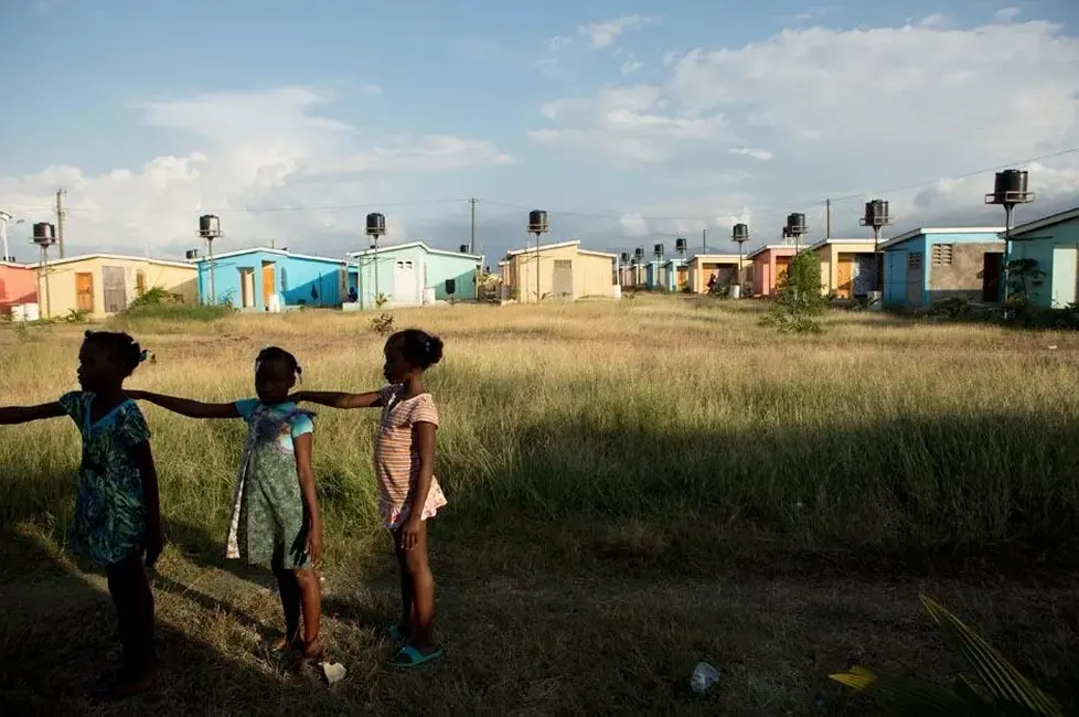 Third graders practice a marching drill after school in preparation for a Flag Day ceremony planned for May 18 in the village of La Difference. Image by Allison Shelley. Haiti, 2015. Media file: screen_shot_2015-05-05_at_11.50.16.jpg