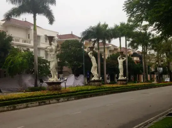 Statues of Greek gods on a tree lined road in Ciputra International City, in Hanoi’s Tay Ho district. Image by Claire Provost. Vietnam, 2015. Media file: ciputra_sculptures.jpg