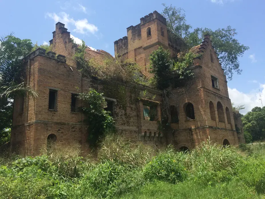 For a few cigarettes, a Congolese policeman will guide you around Dungu’s Belgian colonial-era chateau. Image by David Gauvey Herbert. Democratic Republic of the Congo, 2016.