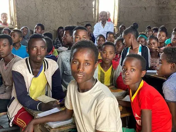 Hagirso at 21 in fourth grade classroom. Image by Anne Thurow. Ethiopia, 2019. Hagirso at 21 in fourth grade classroom. Image by Anne Thurow. Ethiopia, 2019.