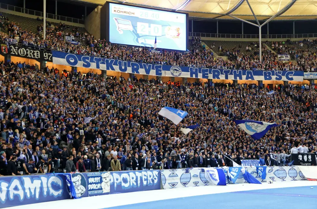 A scene from the past? Hertha BSC Berlin ultras seen during a German Bundesliga game against Bayer 04 Leverkusen. Image by Oleksandr Prykhodko / Shutterstock. Germany, 2017. A scene from the past? Hertha BSC Berlin ultras seen during German Bundesliga game against Bayer 04 Leverkusen. Image by Oleksandr Prykhodko / Shutterstock. Germany, 2017.